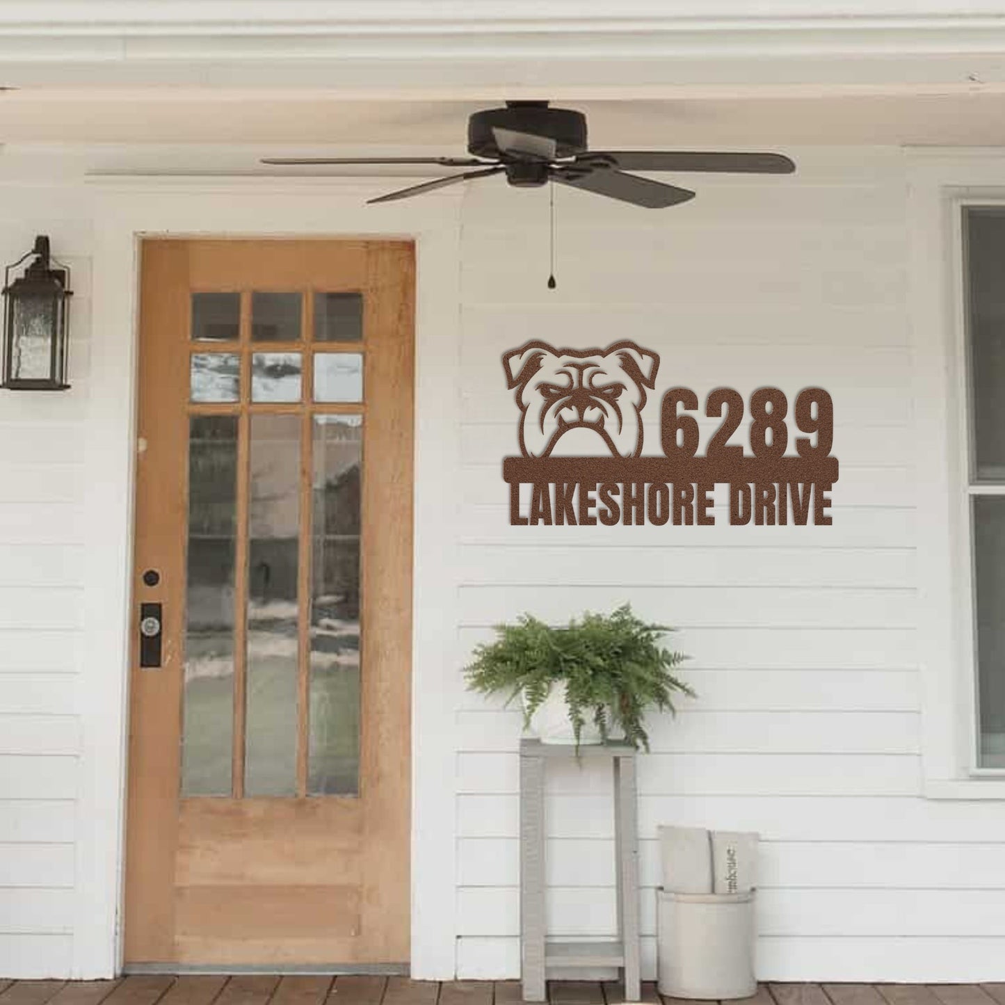 Metal Address Sign for Bulldog Home hanging next to front door