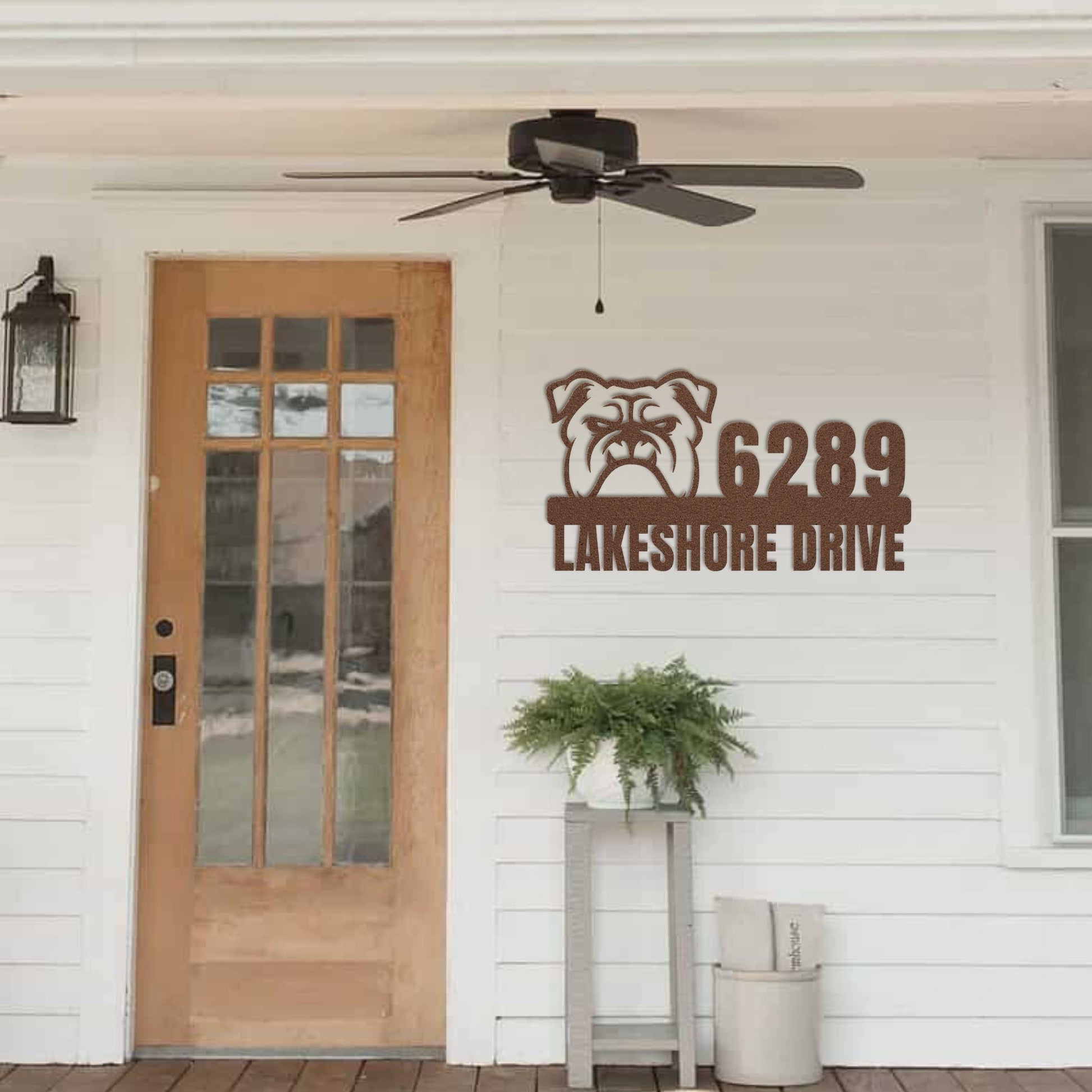 Metal Address Sign for Bulldog Home hanging next to front door