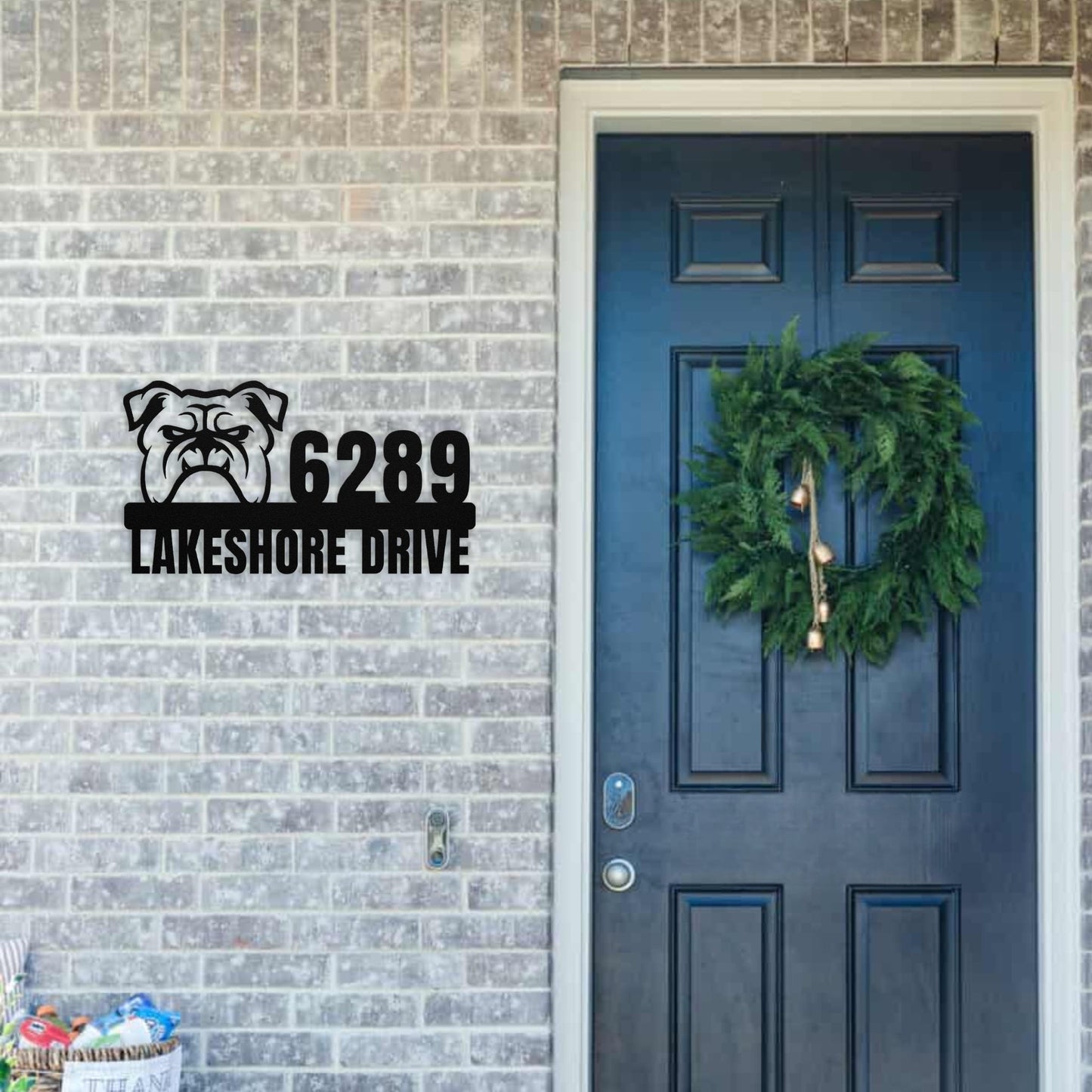 Metal Address Sign for Bulldog Home hanging next to front door